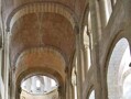 View of the nave of the church of St. Foy at Conques, contemporary with Durham Cathedral. The simple vaults used limited the builders' capacity to span a large width, and therefore the nave it very narrow. It was the use of pointed arches and rib vaults at Durham Cathedral that enabled the construction of a wide nave, and paved the way for the soaring buildings that reached their zenith with Gothic architecture.