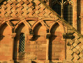 Detail of the stone carving on the exterior of Durham Cathedral. Circa 1100. The use of lozenges (diamond shapes) and intersecting arches was common in Romanesque architecture. (See previous image). The combination of recessed and projecting lozenges, as seen here, would have been especially effective in sunny climates where the contrast between the recesses and the projections would have been striking. This pattern may have been seen in Spain and copied from there.