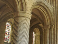 The geometric designs carved in the stone pillars of Durham Cathedral were common in Norman architecture. The specific details of these suggest that the masons who carved them also worked on Lindisfarne Priory to the North of Durham.